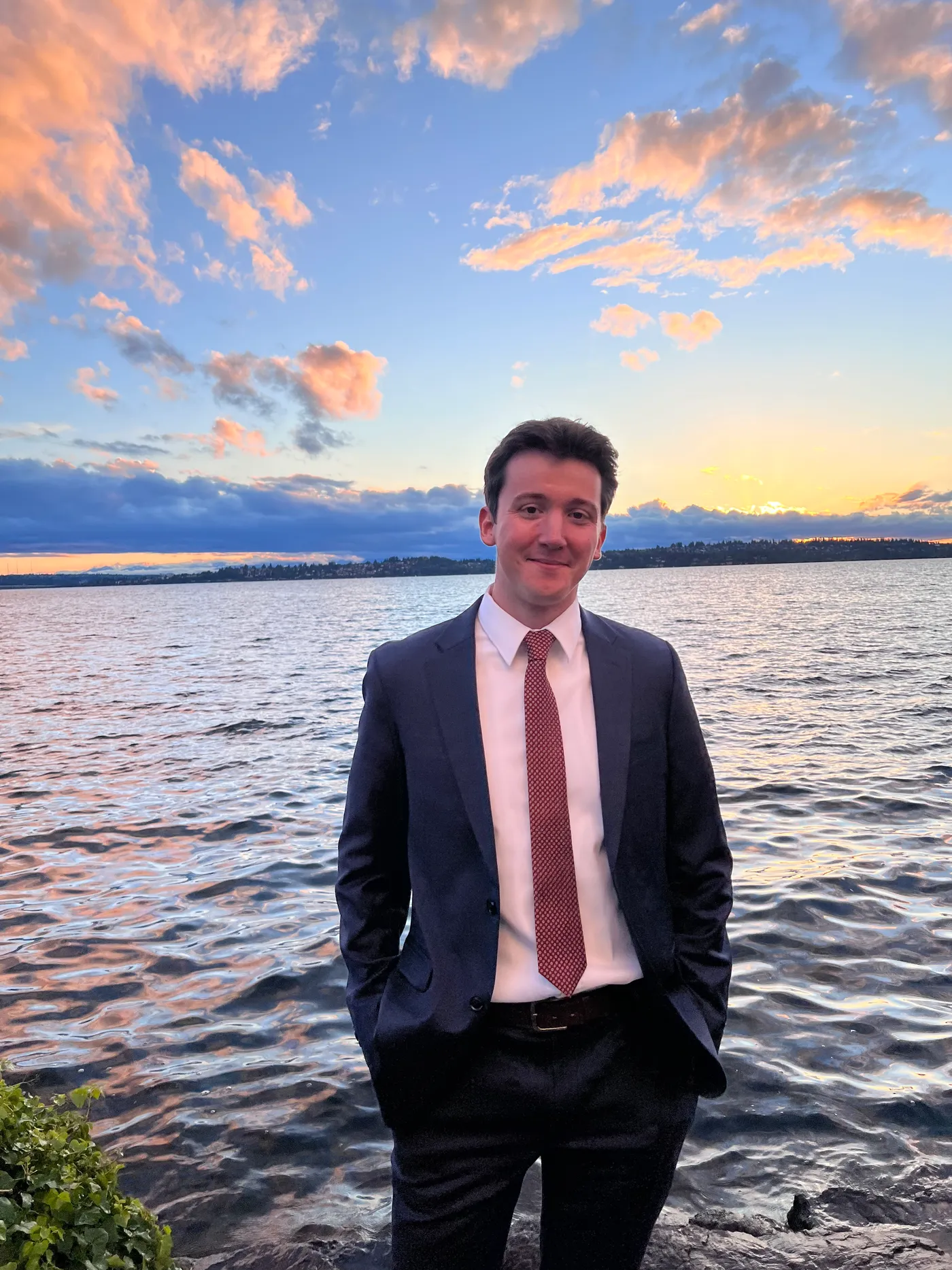 Ethan Meitz by the water at sunset